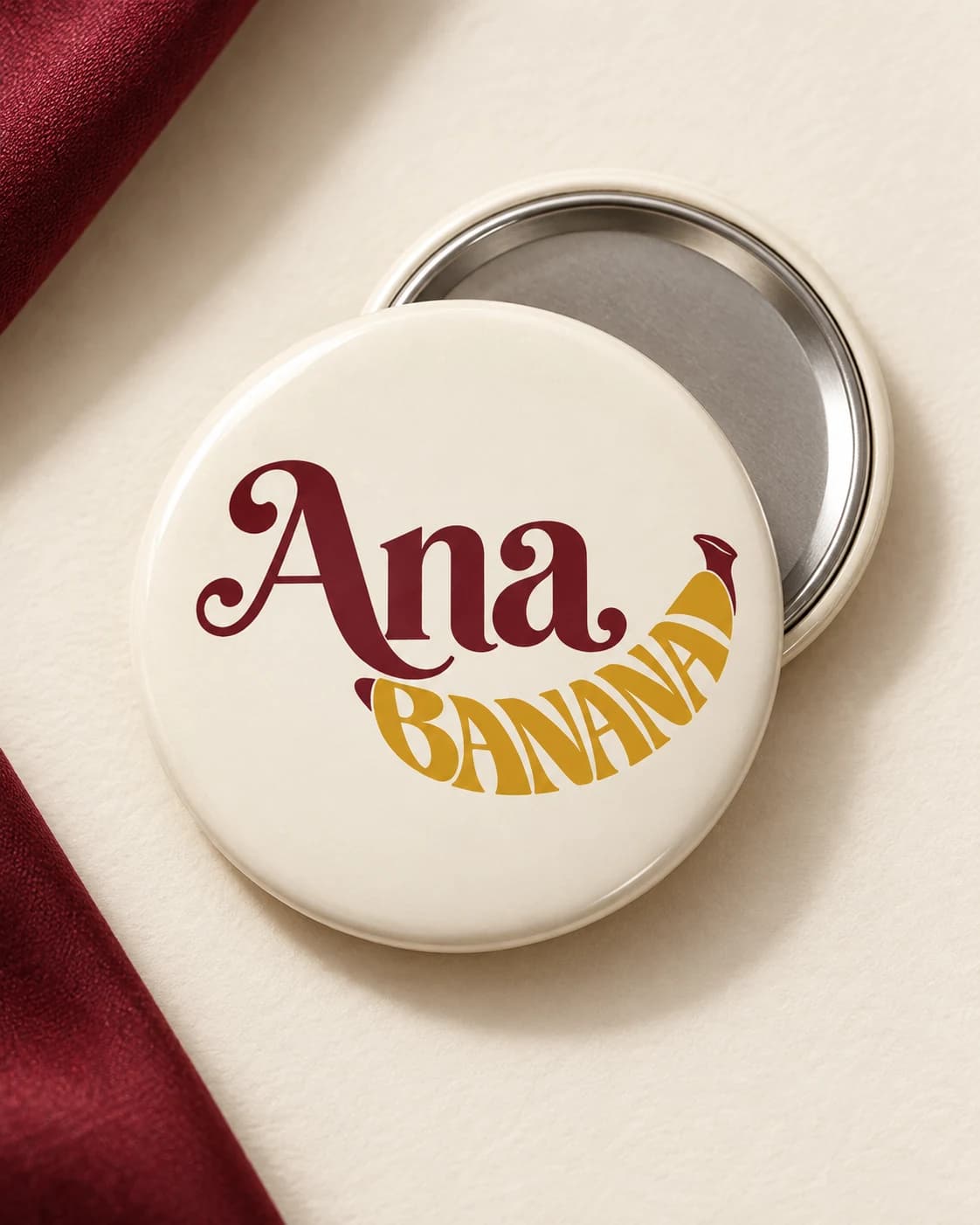 Visual study of a round Ana Banana button on warm fabric